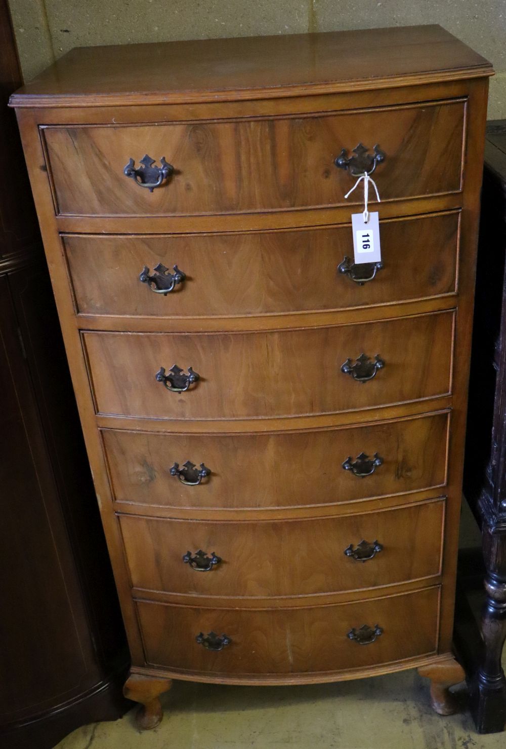 A reproduction walnut bow front six drawer chest, width 63cm depth 43cm height 123cm